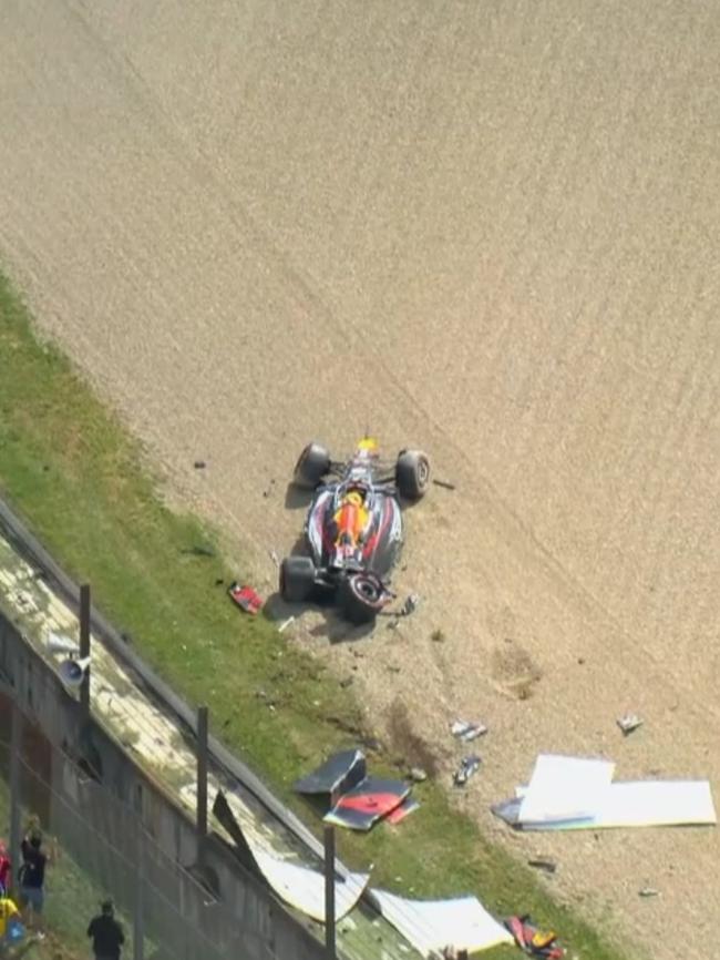 Yuki Tsunoda's Red Bull was parked in the dirt.