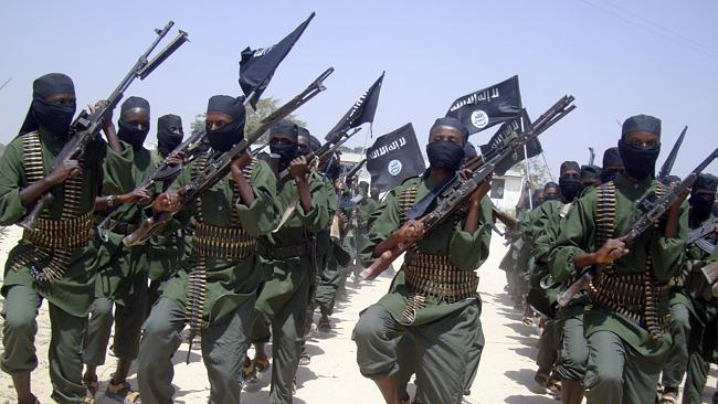 Al-Shabab fighters march with their weapons during military exercises on the outskirts of Mogadishu, Somalia. Picture: Mohamed Sheikh Nor