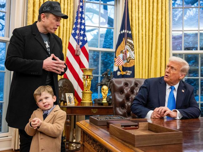 President Donald Trump with Elon Musk and his son in the White House. Picture: AFP