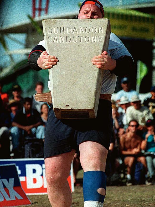 Edwards carries a block of stone at Sydney's Royal Easter Show in 1998.