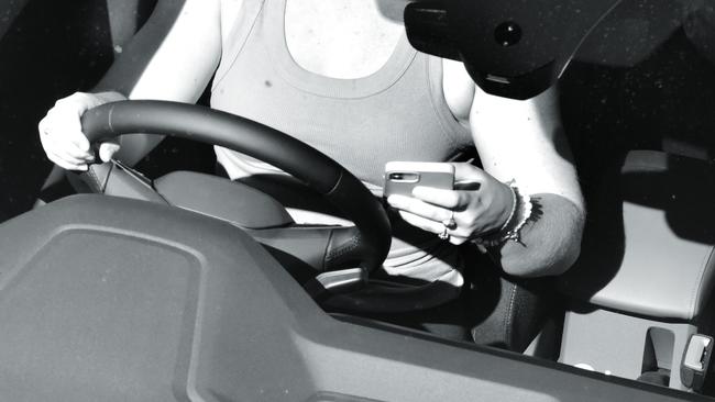 A driver is caught by the cameras using a mobile phone and not wearing a seatbelt.