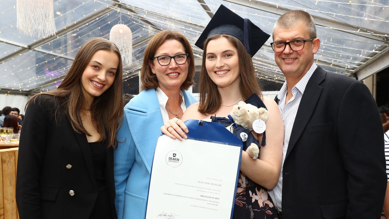 Deakin graduate Ellie Mueller with sister Lauren and parents Angela and Mark. Picture: Alison Wynd