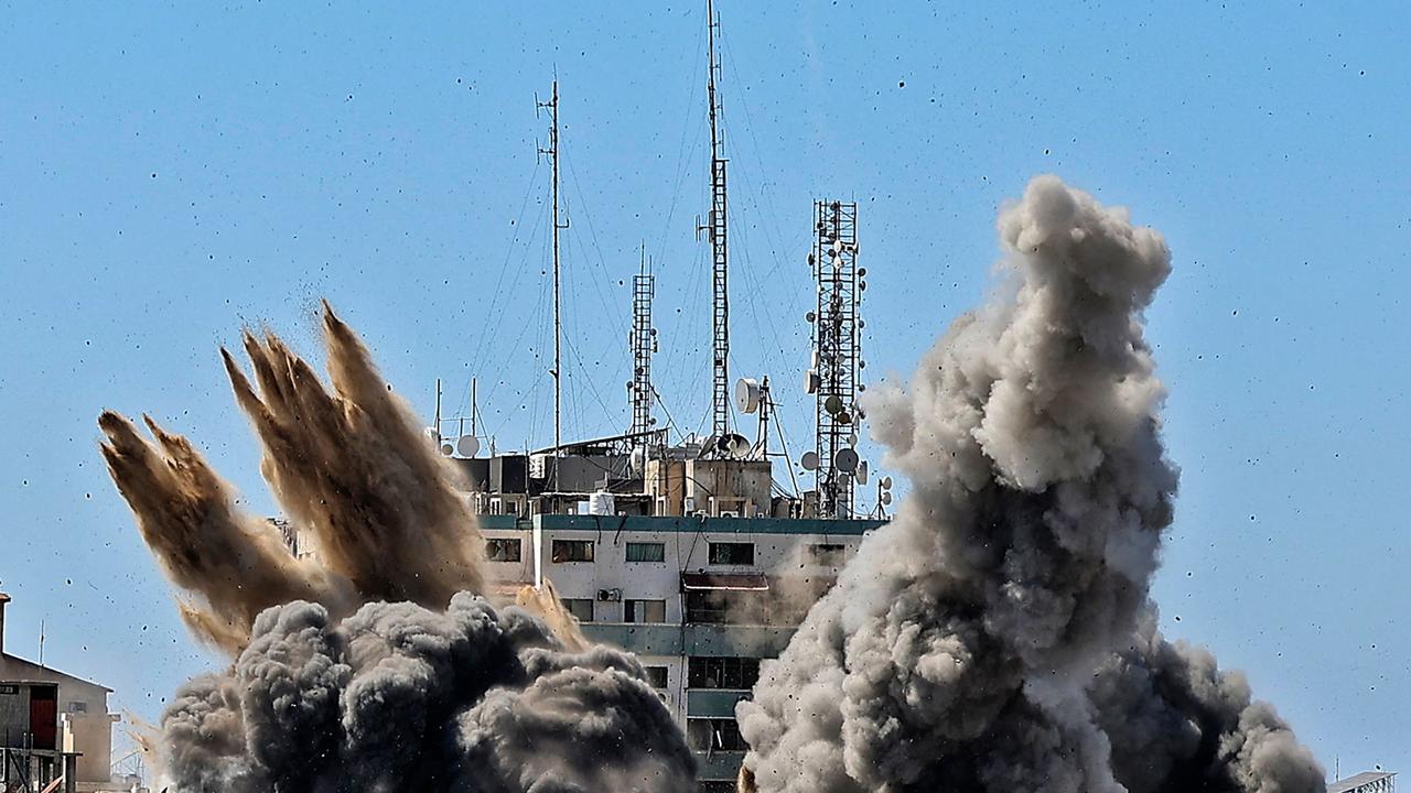 Smoke billows as an air bomb is dropped on the Jala Tower during an Israeli air strike in Gaza city on May 15, 2021. Picture: Mahmud Hams / AFP