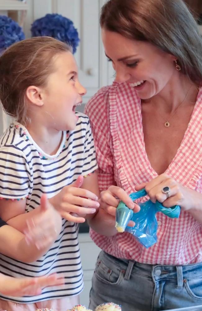 The Duchess of Cambridge and Princess Charlotte laugh as they bake the cupcakes.