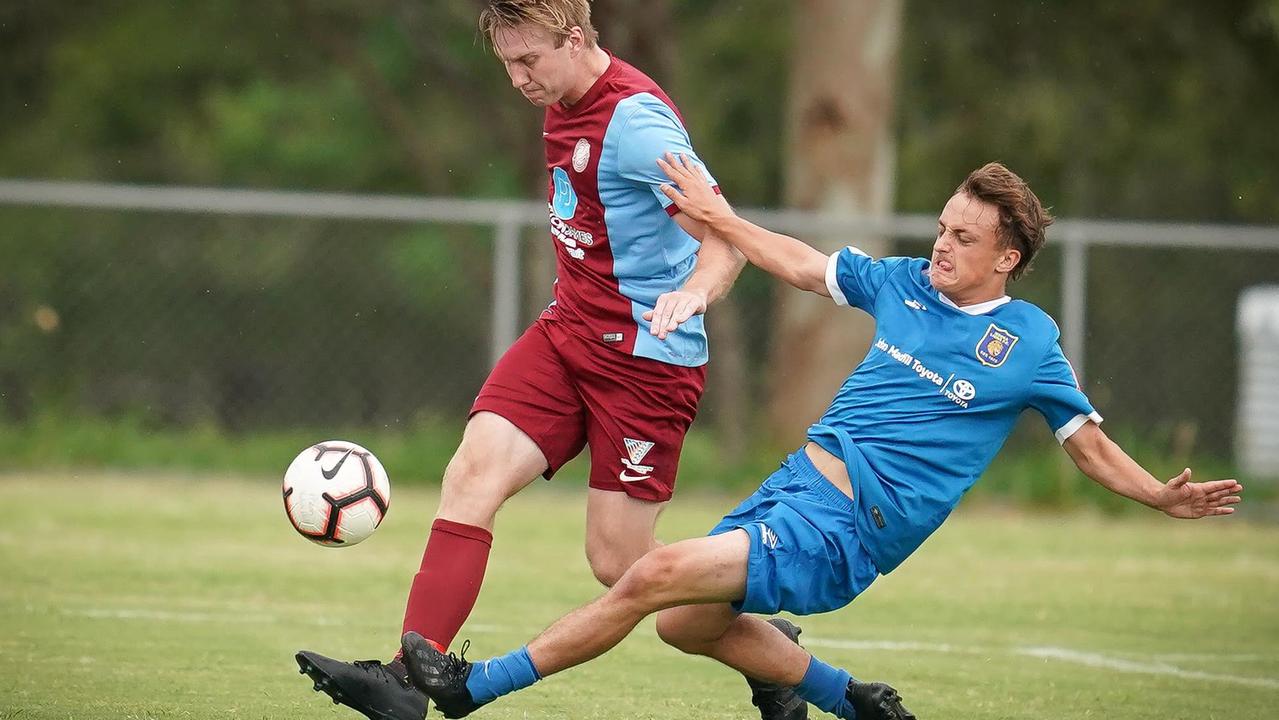 The Noosa Lions young goal scorer Nathan Weckert shows his determination.