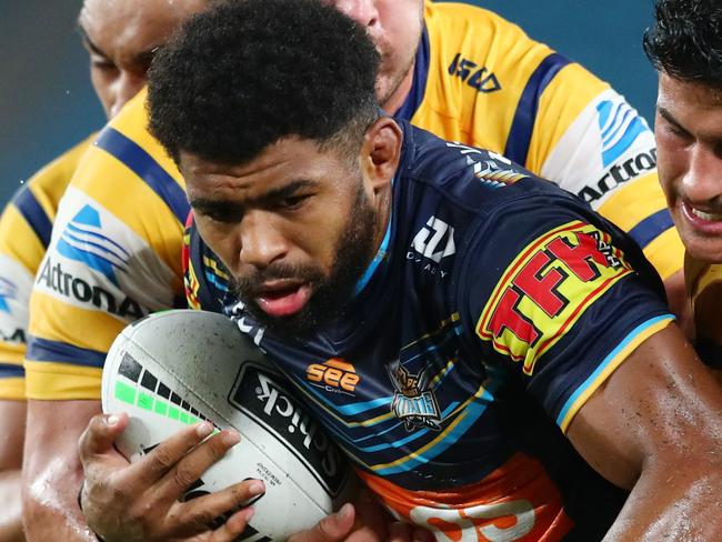 GOLD COAST, AUSTRALIA - MARCH 22: Kallum Watkins of the Titans is tackled during the round 2 NRL match between the Gold Coast Titans and the Parramatta Eels at Cbus Super Stadium on March 22, 2020 in Gold Coast, Australia. (Photo by Chris Hyde/Getty Images)