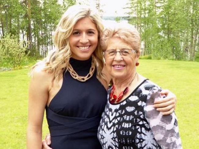 Holly Butcher (left) pictured at her brother Dean's wedding at a lakeside cottage in Finland on June 13, 2015.