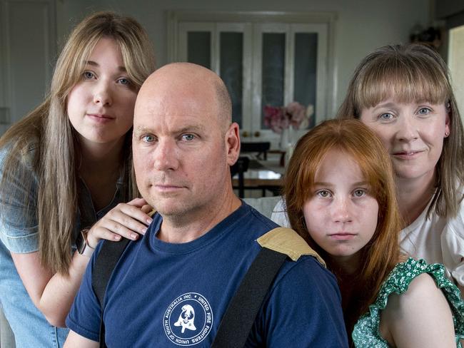 Fire Fighter Gary Marsh with his wife Shani and daughters Teiana  ,17,and Isla,13 with their dog Bernie an Aussie Mountain Doodle at their Fairview Park home.Wednesday,January,29,2025.Picture Mark Brake