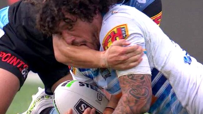 The moment Proctor’s mouth came into contact with Johnson’s arm, sparking an on-field furore. Picture: Fox Sports