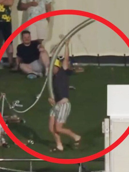 Burtt with his giant beer snake interrupting play on day one of the Australia v India Test at Adelaide Oval. Picture: Fox Cricket