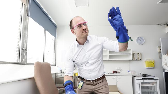 Site pharmacist at the Royal Hobart Hospital Duncan McKenzie holds a test vial in the new Royal Hobart Hospital COVID-19 vaccination hub. Picture: Zak Simmonds