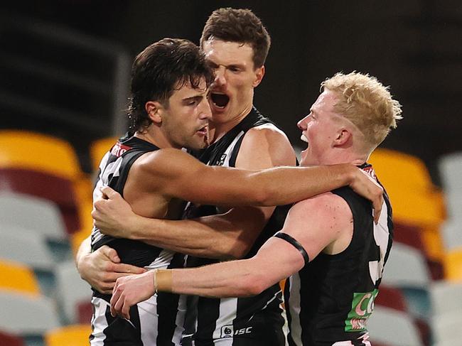 AFL Round 10. Collingwood vs Sydney at the Gabba, Brisbane.  06/08/2020. Josh Daicos of the Magpies celebrates his goal in the fourth quarter with teammates   . Pic: Michael Klein