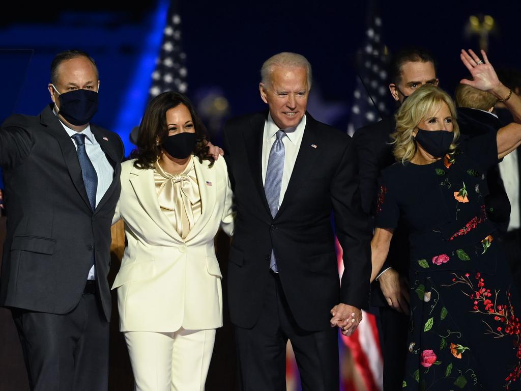 US President-elect Joe Biden and Vice President-elect Kamala Harris stand with spouses Jill Biden and Doug Emhoff after their election win. Picture: AFP