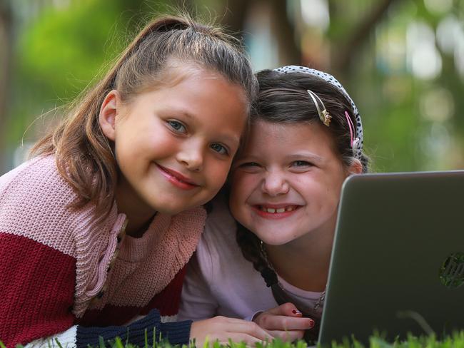 LIVERPOOL LEADER/AAP. Students Baylee Dwyer age 9 and her sister Bronte Dwyer age 7 from Casula Public School, use their computer for their school lessons. Casula on Thursday 9 April, 2020. Casula PS is using the Seesaw app so its 900 students, many of whom come from a diverse background, can continue to learn during the covid-19 pandemic. (AAP IMAGE / Angelo Velardo)