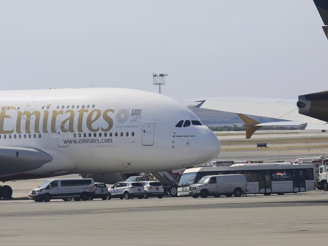 Emergency response crews gather outside a plane at JFK Airport amid reports of ill passengers aboard a flight from Dubai. Picture: AP