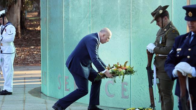 Defence Minister Peter Dutton lays a reef at the service. Picture: NCA NewsWire / Gary Ramage