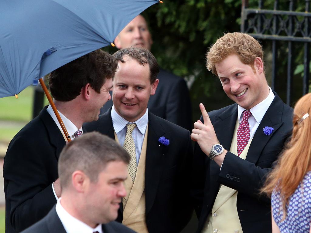 Prince Harry with a group of friends outside a wedding on June 22, 2013. Picture: Scott Heppell/AP