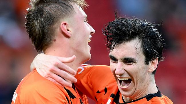 BRISBANE, AUSTRALIA - FEBRUARY 10: Thomas Waddingham of the Roar celebrates with team mate Henry Hore after scoring a goal during the A-League Men round 16 match between Brisbane Roar and Melbourne City at Suncorp Stadium, on February 10, 2024, in Brisbane, Australia. (Photo by Bradley Kanaris/Getty Images)