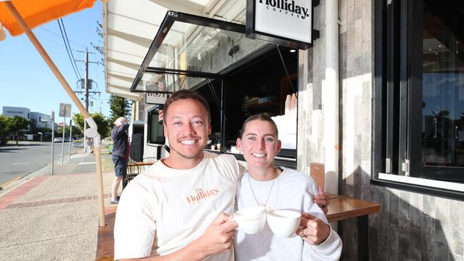 Holliday Coffee owner Marcus Wilkins and partner Olivia Ayres are staying at Nobby Beach despite the demise of neighbouring restaurant Okawari House. Picture Glenn Hampson