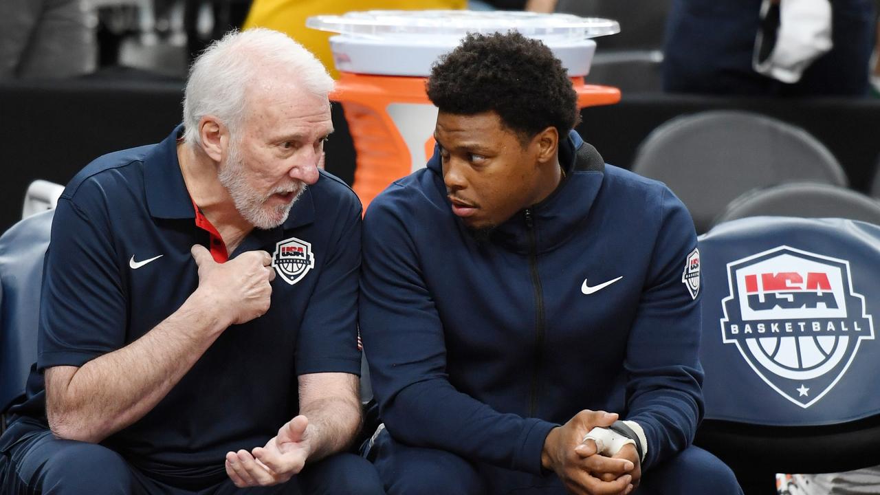 Kyle Lowry with US head coach Gregg Popovich.