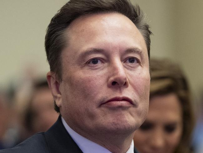 Elon Musk, left, sits with Kelly Johnson, wife of House Speaker Mike Johnson of La., as President-elect Donald Trump speaks at a meeting of the House GOP conference, Wednesday, Nov. 13, 2024, in Washington. (AP Photo/Alex Brandon)