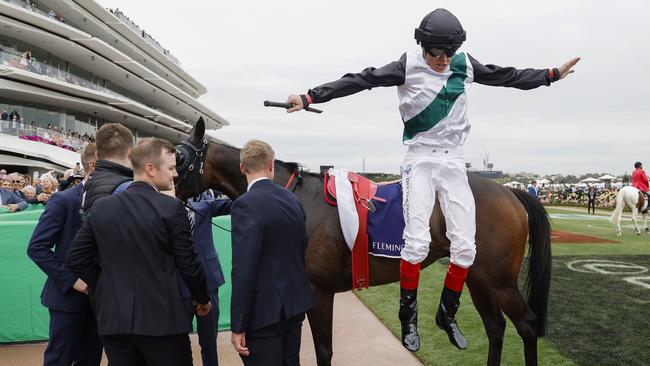 Craig Williams jumps off Mr Brightside after winning the Champions Mile. Picture: Michael Klein