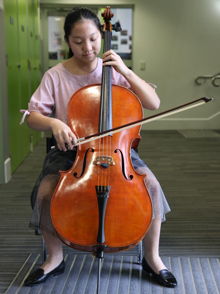 Flora Yang, 12, warms up on the cello. Picture: Glenn Hampson.