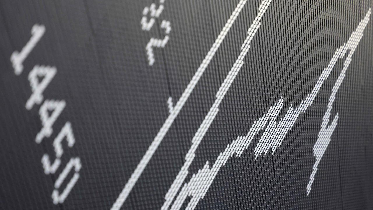 The chart of Germany's share index DAX is displayed at the stock exchange in Frankfurt am Main, western Germany, on March 20, 2023. - Shares in European banks sank despite a buyout of Credit Suisse by Swiss lender UBS aimed at preventing a global banking crisis. (Photo by Daniel ROLAND / AFP)