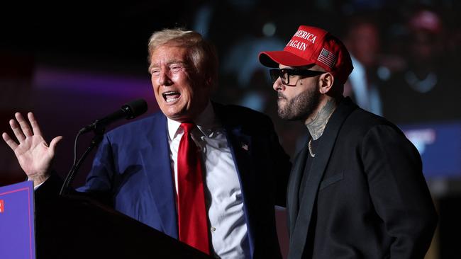 Donald Trump appears on stage with recording artist Nicky Jam. Picture: Getty Images