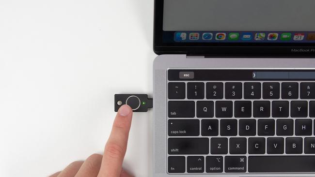 You push the Bio into a USB port and press the button with a registered finger print to authenticate