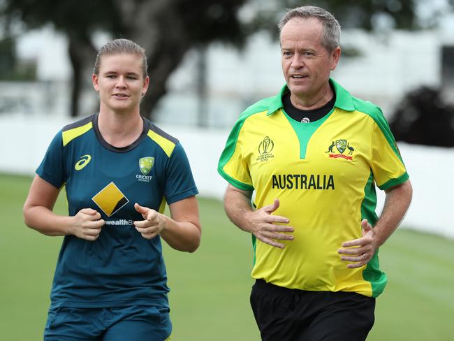 Bill Shorten and Australian spin bowler Jess Jonassen at Allan Border Field in Albion, Brisbane. Picture: Liam Kidston