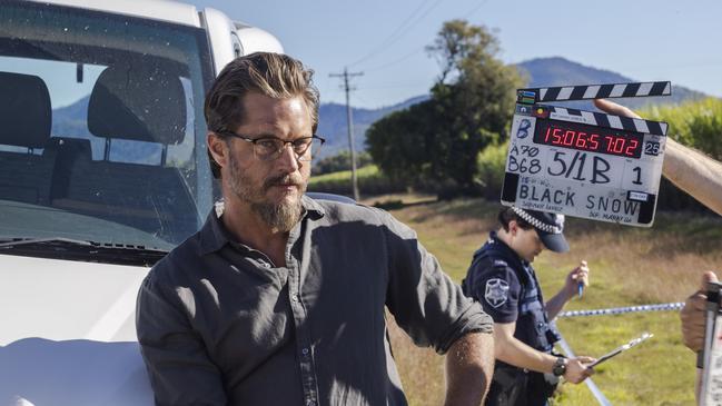 Behind the scenes photo from the filming of Stan original Black Snow featuring Travis Fimmel as Detective James Cormack. Picture: Stan / Supplied