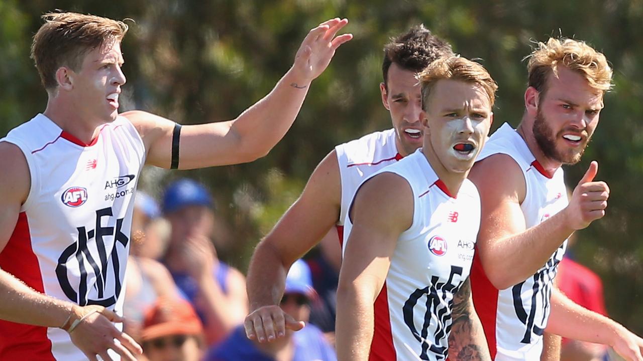 MELBOURNE, AUSTRALIA - MARCH 06: Jack Watts of the Demons is congratulated by team mates after kicking a goal during the 2016 AFL NAB Challenge match between the Western Bulldogs and the Melbourne Demons at Highgate Reserve on March 6, 2016 in Melbourne, Australia. (Photo by Quinn Rooney/Getty Images)