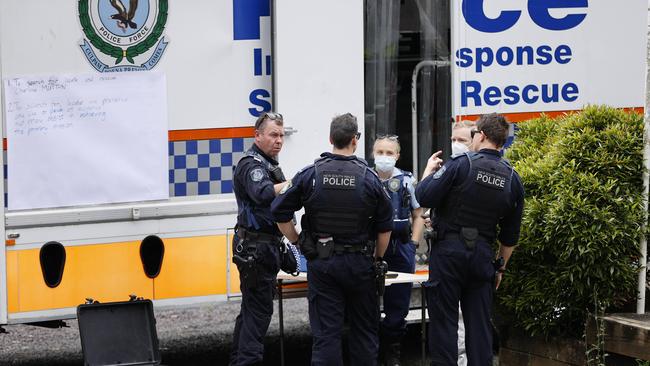 Police officers join in the search. Picture: Tim Hunter