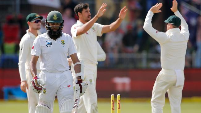 Hashim Amla departs after being bowled by Mitchell Starc. Picture: AFP