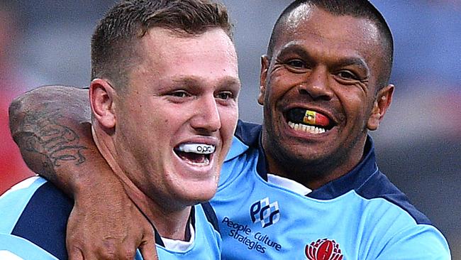 Kurtley Beale celebrates with try scorer Angus Bell during the Waratahs’ win over the Lions.