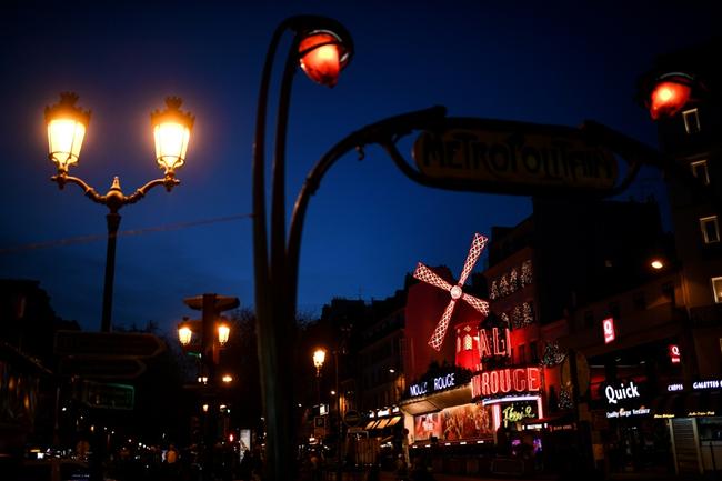 This picture taken at dusk on January 13, 2023 shows the Moulin Rouge entertainment venue in Paris.