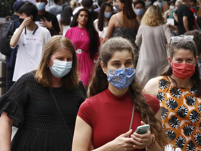 MELBOURNE, AUSTRALIA - NOVEMBER 27: People walk along a busy Bourke Street Mall on November 27, 2020 in Melbourne, Australia. Victoria has recorded no new coronavirus cases for the 28th consecutive day, meeting the official definition for elimination. (Photo by Daniel Pockett/Getty Images)