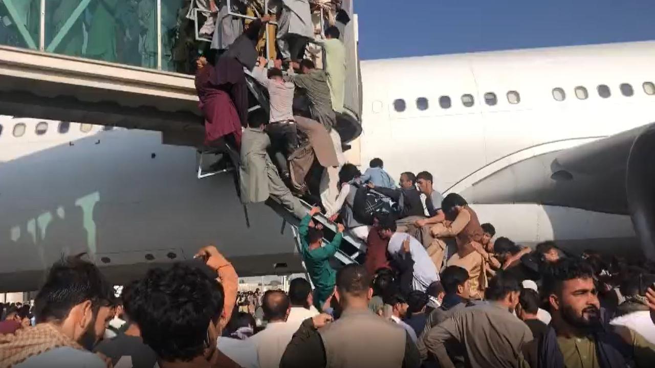 Civilians try to board planes to flee the Taliban. Picture: Twitter