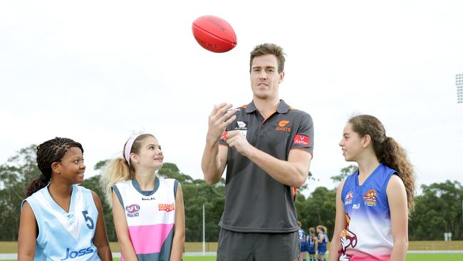 GWS star Jeremy Cameron at Blacktown International Sports Park with U/15 players Harriet Owusu, 12, Shelby Draper, 13, Tahlia Ravello, 12. Photo: Adam Ward