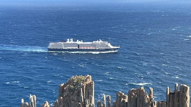 A cruise ship sails past Cape Roaul on the Tasman Peninsula. Picture: Philip Young