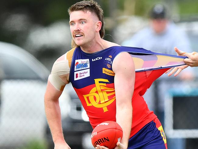 Mitchell Day of Diggers Rest is tackled by Owen Fowler of Wallan during the round two RDFNL Bendigo Bank Seniors match between Diggers Rest and Wallan at Diggers Rest Recreation Reserve, on April 13,2024, in Diggers Rest, Australia. (Photo by Josh Chadwick)