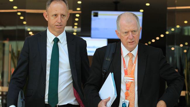 Sydney Trains CEO Howard Collins (right) emerges from the meeting with union heads.