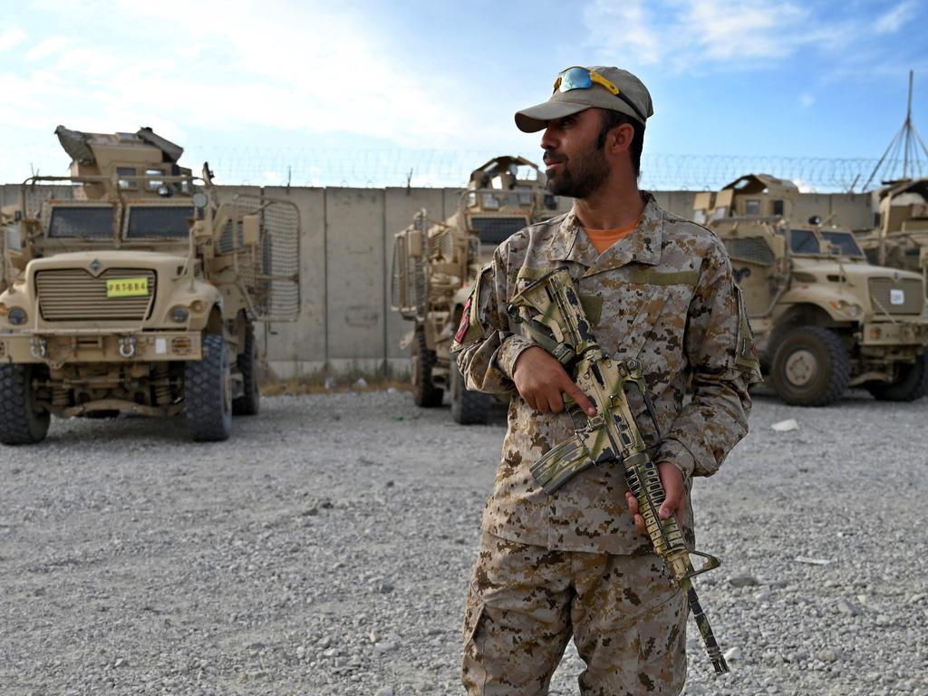 An Afghan policeman stands guard inside Bagram US air base, which the Americans left in the dead of night without notifying the Afghans. Picture: Wakil Koshar/AFP