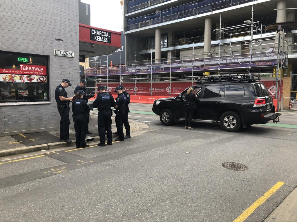 Police search Waymouth St for evidence.