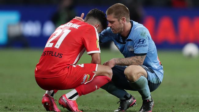 Luke Brattan (R) comforts Ramy Najjarine. Picture: Mark Metcalfe/Getty