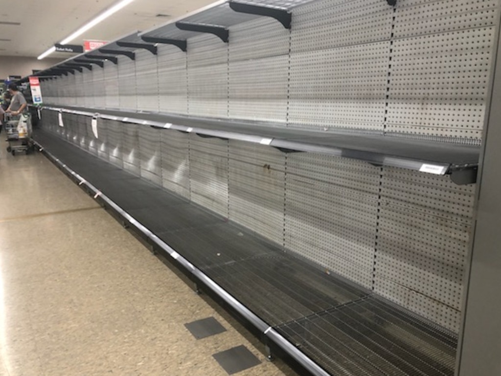 Shelves across the country have been stripped bare forcing Woolworths, Coles, IGA and Aldi to introduce strict buying limits.