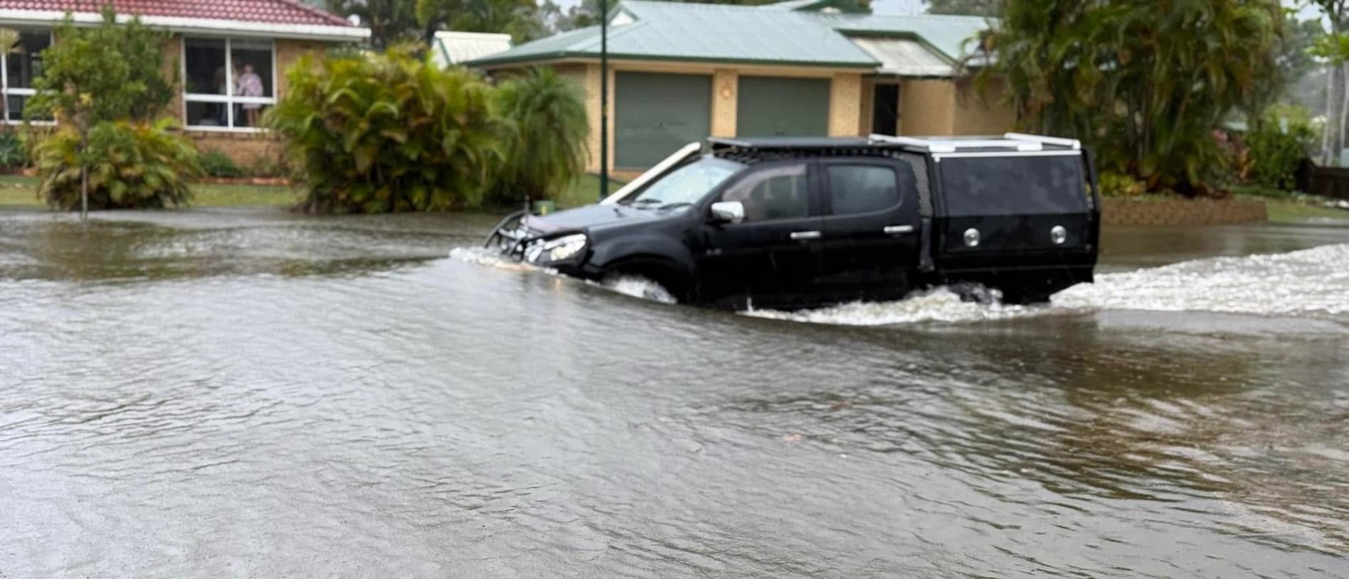 Flooding on Ibis Boulevard in Eli Waters during the wild weather brought by ex-Tropical Cyclone Alfred. Photo: Chris Bergin