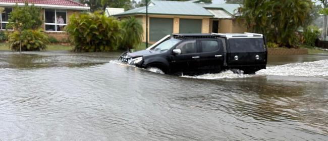 Flooding on Ibis Boulevard in Eli Waters during the wild weather brought by ex-Tropical Cyclone Alfred. Photo: Chris Bergin