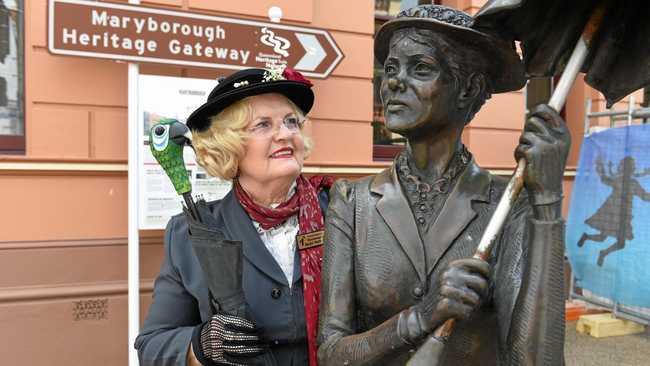 TWO MARYS: Mary Poppins (Carmel Murdoch) with the Poppins statue on the cnr of Richmond and Kent Sts. Picture: Alistair Brightman